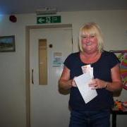Rosalyn McLean winner at the GSPCA World Animal Day Bingo in Guernsey at the Last Post